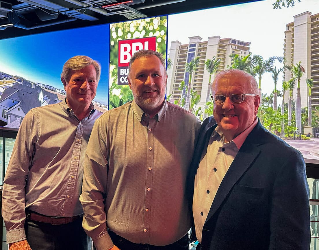 three bbl leadership members smiling for a photo at a construction event