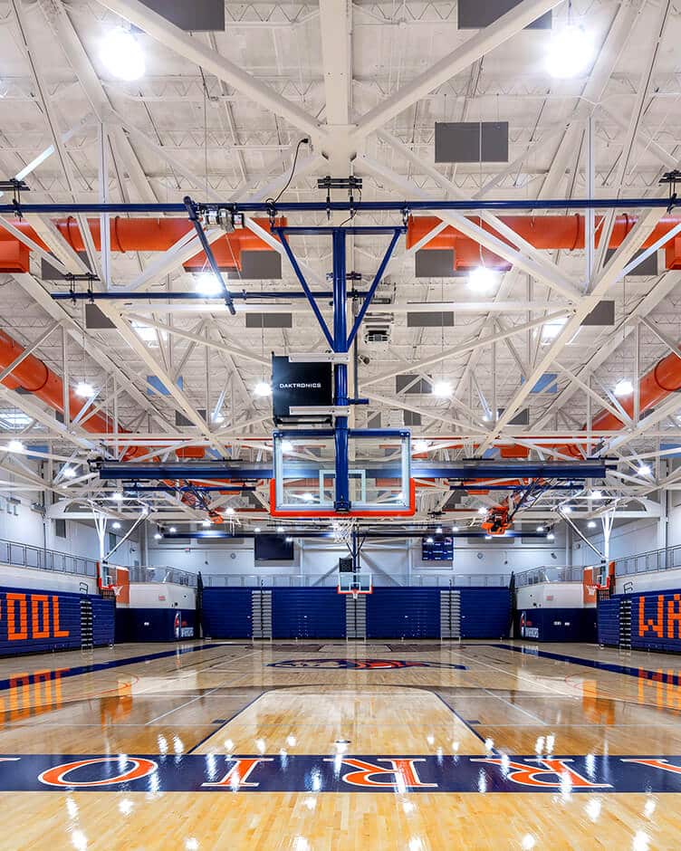 wood blue and orange high school basketball court