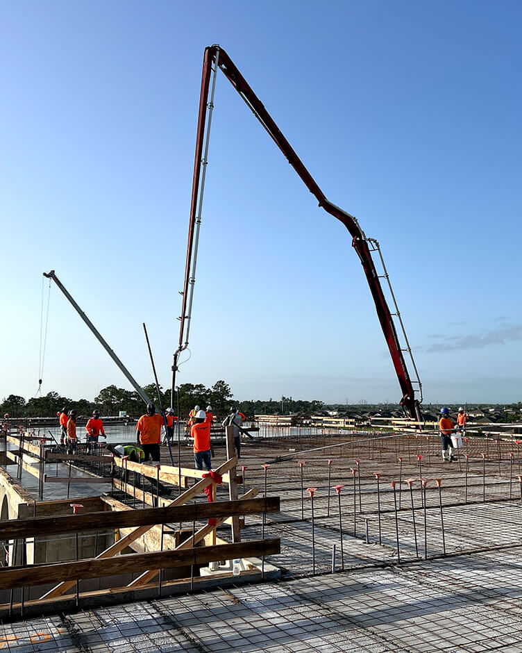 crane machine on site while laying foundations for a commercial property building