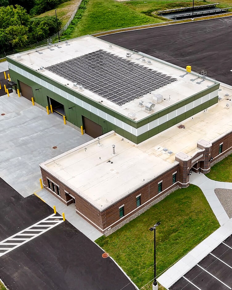 a large industrial building roof and parking lot built by bbl
